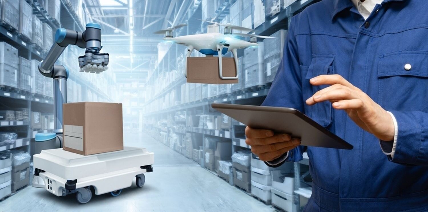 stock photo manager with digital tablet in an automated warehouse with robots and drones 2390212941 transformed e1726746040287